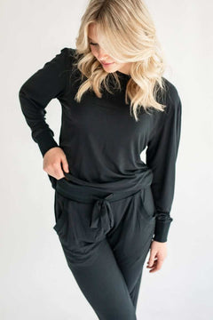 Black Must be Bamboo Pajamas displayed on a model, showcasing the stylish two-piece set with puff sleeves.