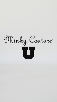 University of Utah mascot holding Minky Couture and black collegiate blankets in a studio setting.