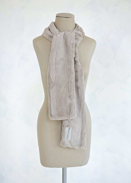Sorbet Scarf in tranquil dove displayed on a mannequin, featuring a smooth texture in a light warm shade.