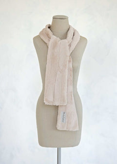 Sorbet Scarf displayed on a mannequin, showcasing its smooth texture and light warmth in Almond Croissant color.