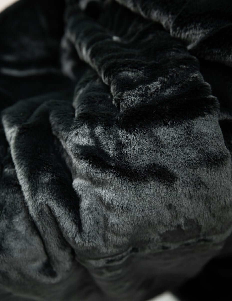 Lush Black Onyx Blanket, showcasing its premium soft texture and luxurious dark color for ultimate comfort.