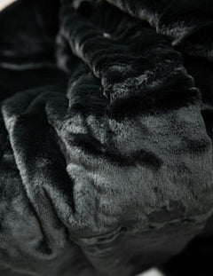 Lush Black Onyx Blanket, showcasing its premium soft texture and luxurious dark color for ultimate comfort.