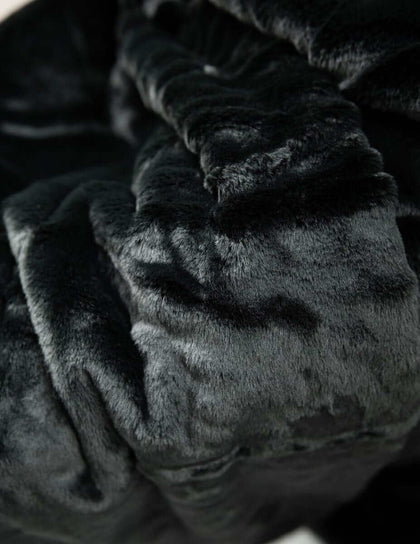 Lush Black Onyx Blanket, showcasing its premium soft texture and luxurious dark color for ultimate comfort.