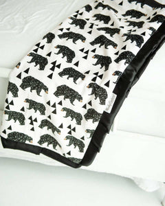 Black and cream My Bear patterned blanket with triangle accents. 