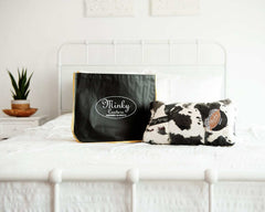 Reusable Shopping Bag by Minky Couture displayed on a bed with a plush blanket.